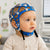 Il bambino indossa la cuffia EEG riutilizzabile a 20 canali della CNSAC per l'EEG pediatrico e la diagnostica del sonno